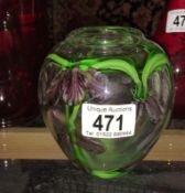 A hand decorated art glass vase