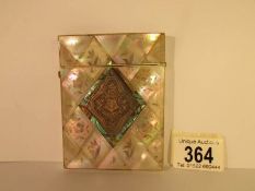 A Victorian monogrammed mother of pearl card case,