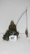 A 19th century bronze Chinese fisherman