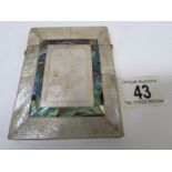 A mother of pearl card case banded with abalone and engraved