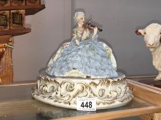 A fine continental figure of a crinoline lady playing a violin
