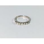 A half carat 7 stone white gold and diamond ring,