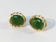 A pair of 18ct gold and jade earrings