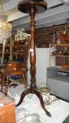 A mahogany tripod plant stand