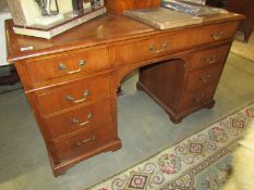 A walnut 9 drawer kneehole desk