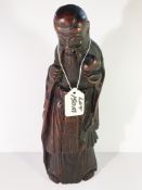 A carved 19th Century bamboo figure of a sage
