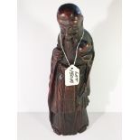 A carved 19th Century bamboo figure of a sage