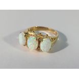 A large 3 stone 9ct yellow gold opal ring size O