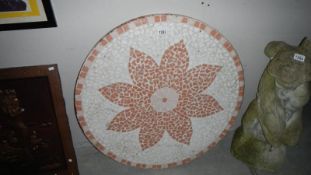 A mosaic metal table top