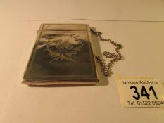 A silver monogrammed card case marked sterling, 9 x 6.