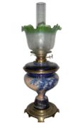 A Victorian Royal Doulton oil lamp with later shade,