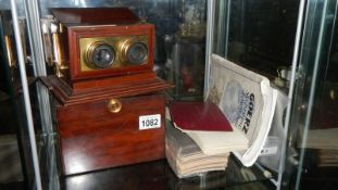 A mahogany cased Victorian stereograph with many 3D cards