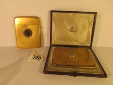 A cased card case with turquoise set horseshoe emblem (Howell James & Co) and one other