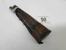 A small (5" long) 18th century horn and leather powder flask