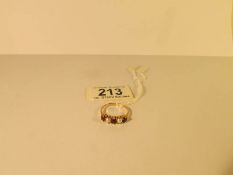 An 18ct gold ring set 2 pearls and 3 garnets,