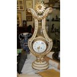 A beautiful French ormolu mounted white marble lyre clock with swinging paste set bezel by Gille l'