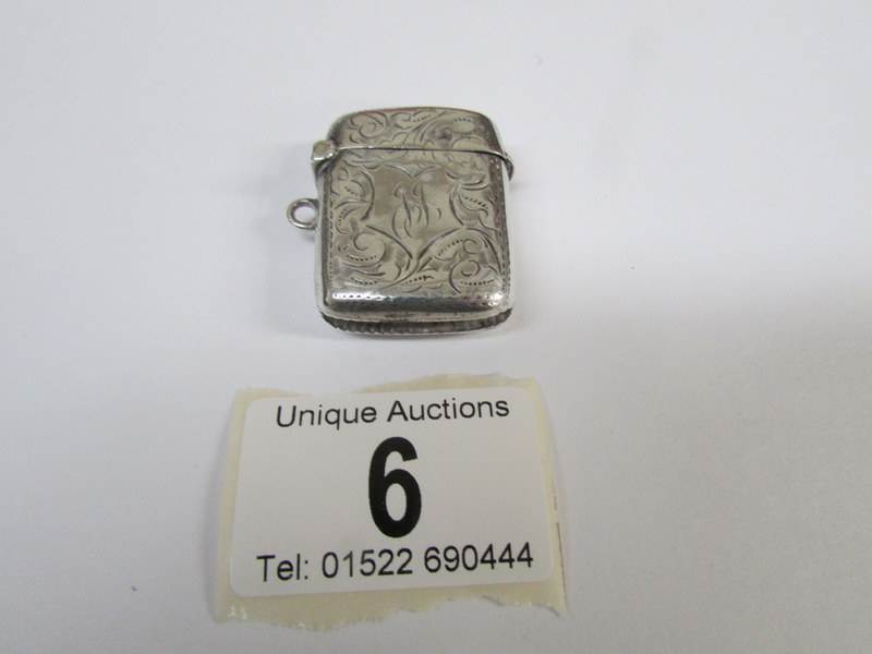 A silver vesta case,