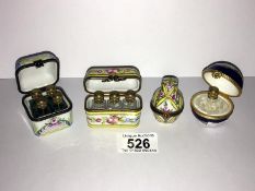 4 Limoges porcelain boxes each containing miniature perfume bottles