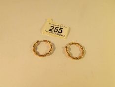A pair of 9ct gold loop earrings in a twisted style