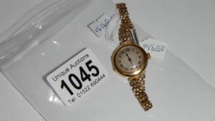 An 18ct gold watch and strap.