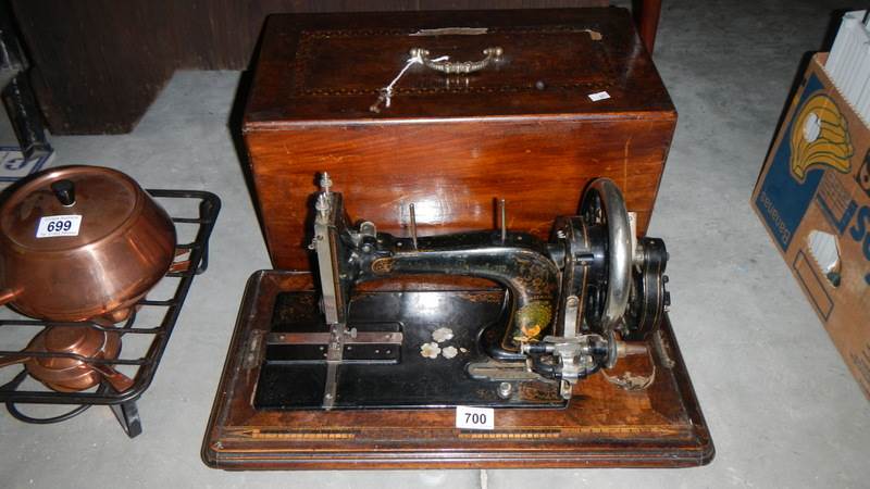 A Victorian German sewing machine with case