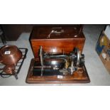 A Victorian German sewing machine with case