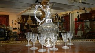 An old claret jug and 6 glasses