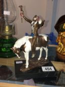 A cold painted bronze figure of a North American Indian chief on horse, foundry coin mark,