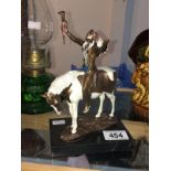 A cold painted bronze figure of a North American Indian chief on horse, foundry coin mark,