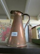 A copper jug stamped J T & S