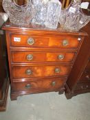A mid 20th century 4 drawer mahogany chest with string inlay,