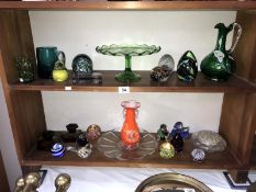 2 shelves of glass ware including paperweights, comport, vase,