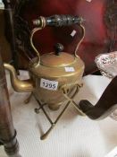 A brass kettle on stand