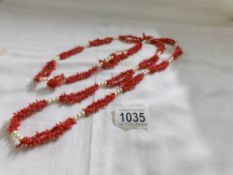 A coral and pearl opera length necklace