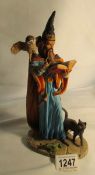 A Royal Doulton hand crafted figure of a wizard