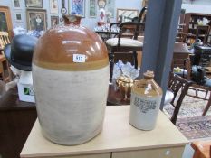 A large stoneware jar marked James Faddow & Co.