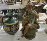 A 19th century pottery figurine of an oyster fisherman and a Tunisian pot by Louis Tissier