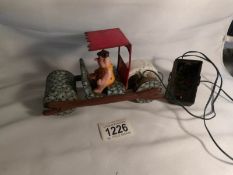 A 1960'S Marx tinplate Flintstones car