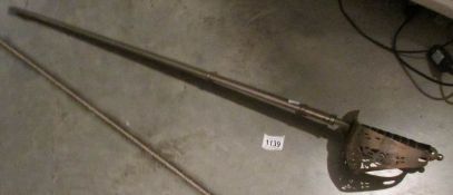 A 20th century cavalry sword with metal scabbard