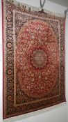 A red ground Kershan rug,
