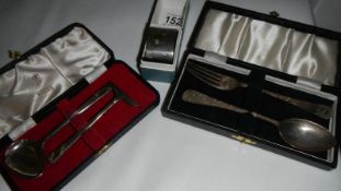 A cased HM silver child's pusher and spoon (49 grams) and a silver monogrammed napkin ring (33