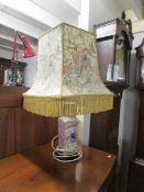 An oriental style table lamp with shade