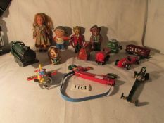 A mixed lot of toys including tin plate, clockwork, locomotive,