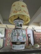 A Chinese table lamp (repaired) with wax shade