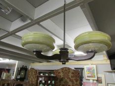 A vintage ceiling light with shades