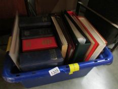 A box containing 11 albums of stamps and covers