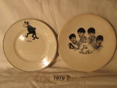 A Beatles plate and a Felix plate,