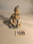 A 19th century bisque oriental nodding seated figurine