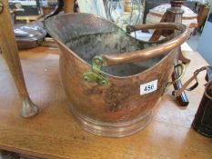 A copper coal scuttle