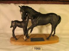 A Beswick Black Beauty with foal